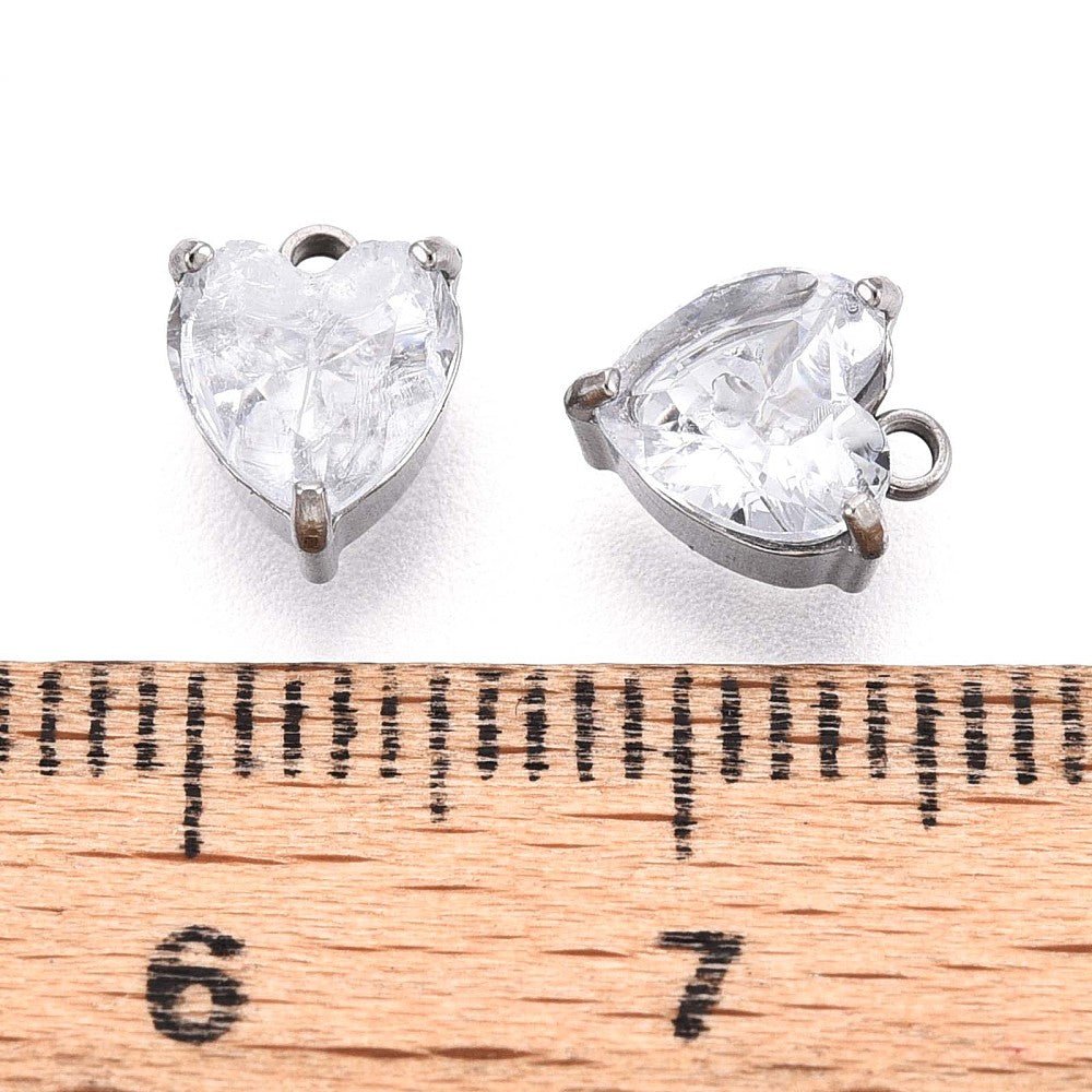 Glashjerte Vedhæng – Facetteret, Vandfast stål (8x6mm, Klar/Stål)2 stk. - Uniq Perler -