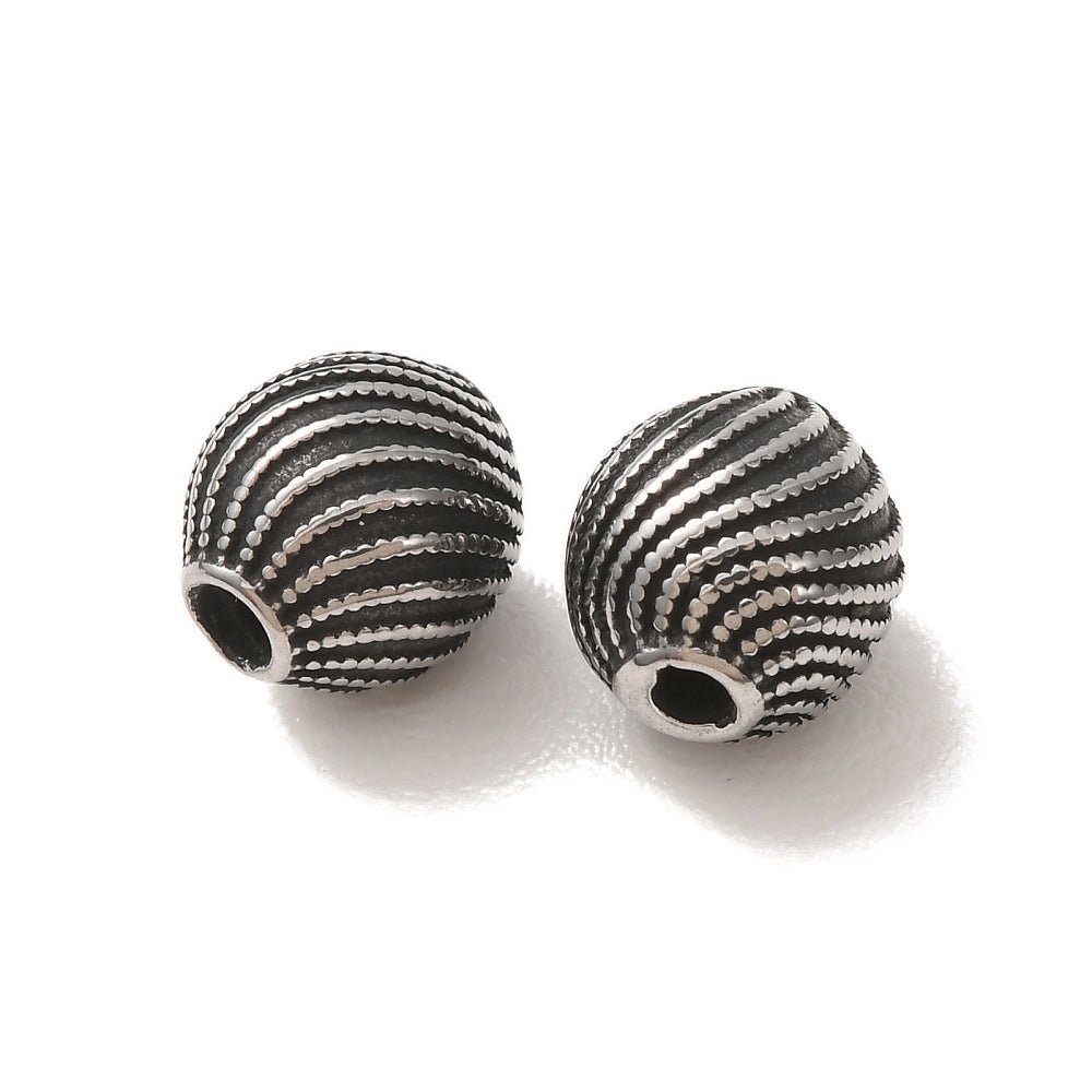 Stål Perler – Oval Med Spiralmønster (8x9mm) 1 stk. - Uniq Perler - 124309