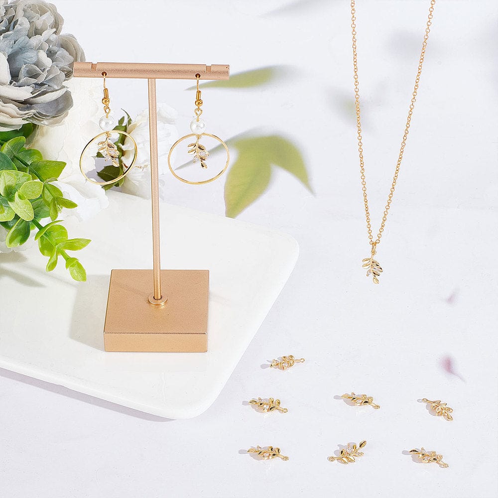 Blad Vedhæng Med Klare Zirkonia Sten, 18K Forgyldt, 17x9mm - Uniq Perler - 5675675646