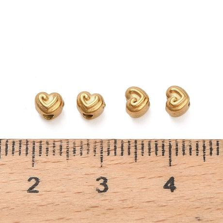 Hjerte Perler i Forgyldt Stål – (3,5x4x4,5mm, 6 stk) - Uniq Perler - 