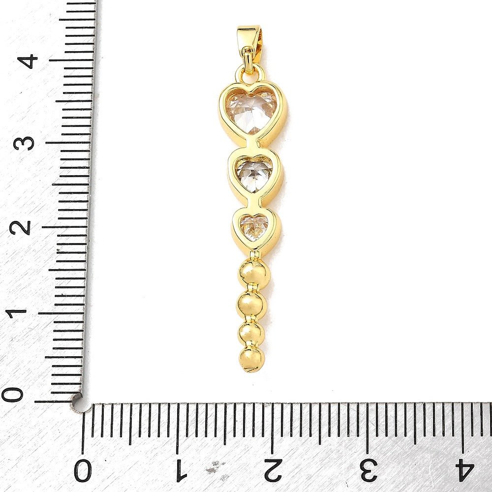 Hjerte Vedhæng Med Klar Zirkonia – 18K Forgyldt Messing (36x7,5x3mm) - Uniq Perler - 125763