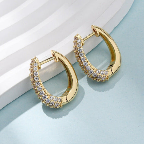 Ovale creol øreringe med zirkonia – 18K forgyldt - Uniq Perler - 