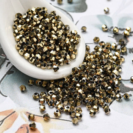 Pandahall Enkelt perler og sæt Elektroplatede Glasperler, Bicones, gyldne, 2x2mm, 50 stk.