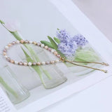 Verstellbares Armband mit Süßwasserperlen - Pastellfarben, (19,5cm) - Uniq Perler - 853578