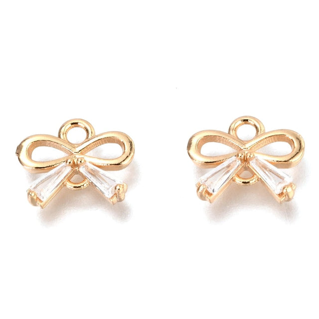 Sløjfe Mellemled Med Klare Zirkonia Sten, 18K Forgyldt, 8,5x10mm - Uniq Perler - 635842