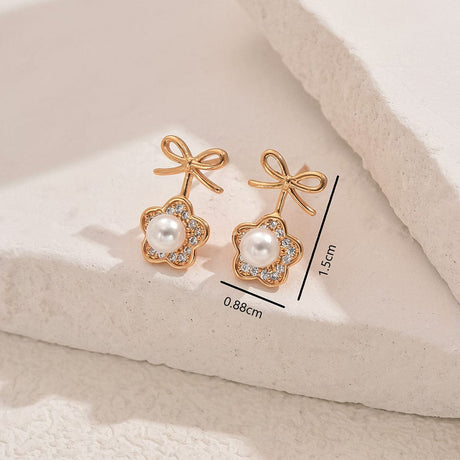 Sløjfe Ørestikkere Med Klare Zirkonia Sten Og Perle - Uniq Perler - 114230