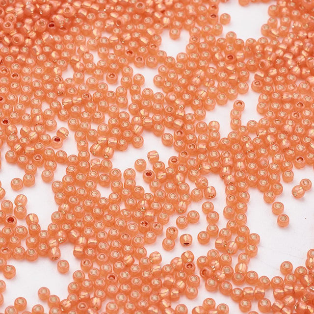 TOHO Seed Beads – TR 2112, Silver Lined Milky Grapefruit (11/0) - Uniq Perler - 119136
