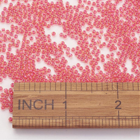 TOHO Seed Beads – TR 979, Luminous Light Topaz/Neon Pink Lined (11/0) - Uniq Perler - 119053