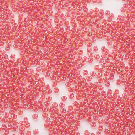 TOHO Seed Beads – TR 979, Luminous Light Topaz/Neon Pink Lined (11/0) - Uniq Perler - 119053
