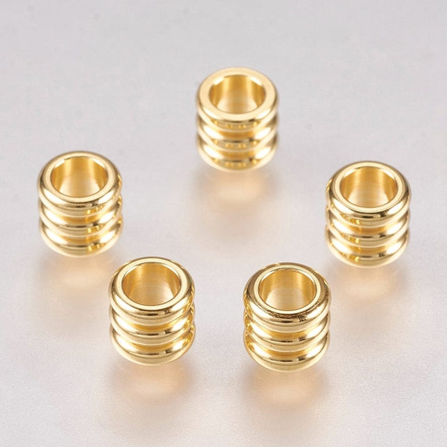 Uniq Perler Metal perler 10 stk. forgyldte stål perler med riller str. 5x4,5  mm