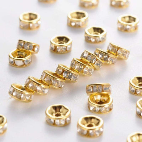Uniq Perler Metal perler Forgyldt 6 mm rondeller med klar sten. 25 stk.